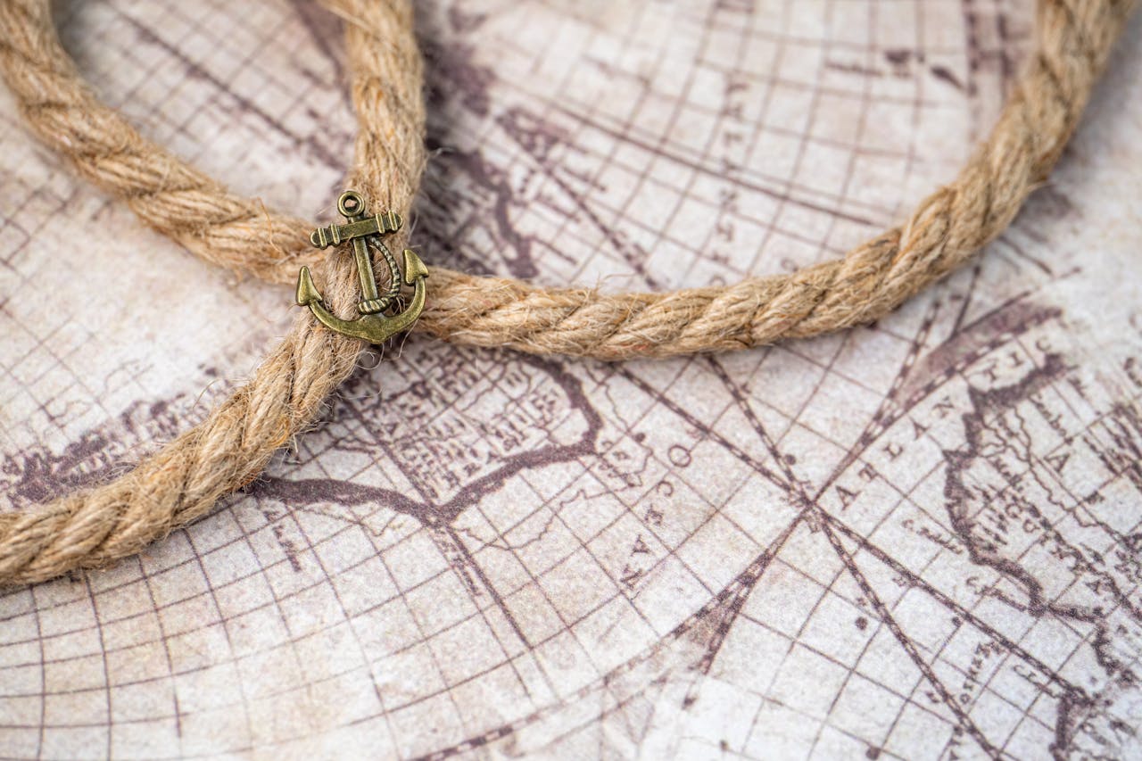 A vintage map with a nautical theme, featuring a rope and anchor symbolizing exploration.